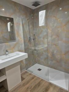 a bathroom with a shower and a sink at Hsdominicus in Cirella