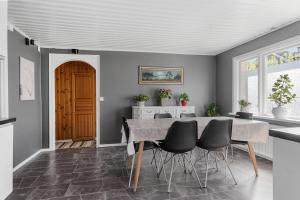 a dining room with a table and chairs at Shared room in a quiet area in Kallinge