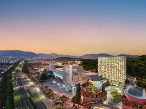 an aerial view of a city at dusk at Grand Mercure Ambassador Changwon in Changwon