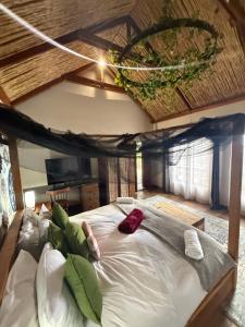 a large bed in a room with a ceiling at Goldeneye Chalet -Hidden Gem of Hartees in Hartbeespoort +53 photos