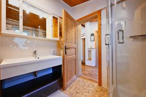 a bathroom with a sink and a shower at Appartements Oberdorfer in Landeck +13 photos