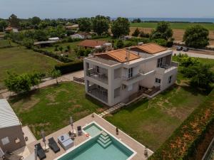 an aerial view of a house with a swimming pool at Marion Apartments in Kourouta