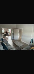 a living room with couches and a coffee table at The Urban Haven in Limerick
