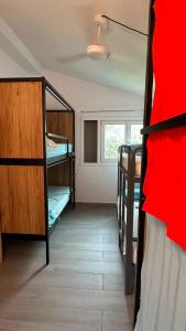 a room with two bunk beds and a window at Can Cocollona in Girona