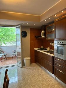 a kitchen with a sink and a stove at A casa di Lea2 in Gioia dei Marsi
