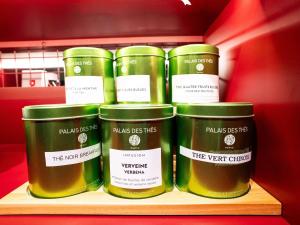 a group of four jars on a shelf at ibis Styles Bourg-en-Bresse Centre in Bourg-en-Bresse