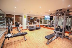 a gym with several treadmills and exercise machines at شير فل in Unayzah +5 photos