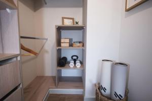 a hallway with two trash cans in a room at Private Terrace with Wellness Studio & Fireplace in Puerto Varas