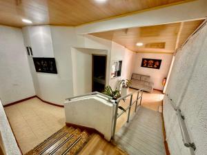 a room with a staircase in a building at Hotel Flamante Bulevar in Bogotá