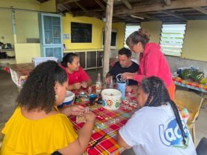 a group of people sitting around a table at Camping Hiva Plage in Parea +41 photos
