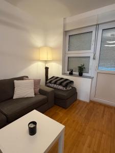 a living room with a couch and a table at DiSte Apartman in Knin +31 photos