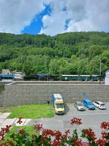 a truck parked in a parking lot next to a wall at Aichinger in Hanušovice