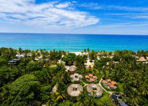 an aerial view of a resort near the ocean at Casa Grande Surf in Guachaca