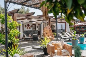 a patio with chairs and a swimming pool at Casa Relogio de Sol in Lamego