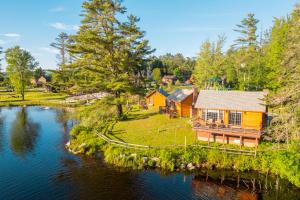 an aerial view of a house on a river at Presidential Mountain Resort in Bethlehem