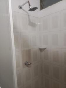 a shower with a shower head in a bathroom at Hotel Villa Sol in Oiba +50 photos