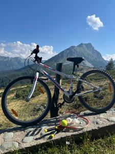 a bike parked on top of a mountain at Komovi Sky House in Andrijevica +10 photos