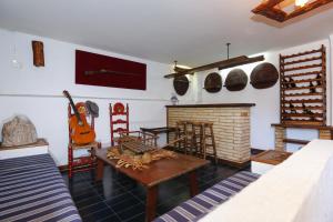 a living room with a guitar and a fireplace at Villa Cococha in Salou +15 photos