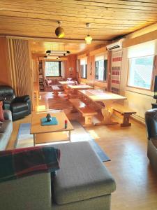 a large living room with a ping pong table at Aurora Grande in Saariselka