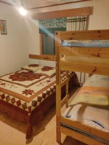 a bedroom with two bunk beds in a room at Aurora Grande in Saariselka