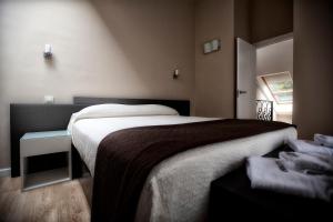 a bedroom with a large bed and a window at Apartamentos Áncora in Barro de Llanes +48 photos