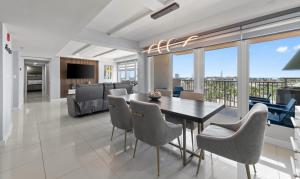 a dining room and living room with a table and chairs at Solare Tower Sunset Panorama Paradise in South Padre Island