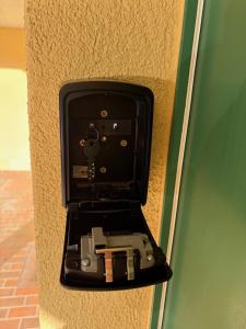 a black box with a camera in it on a wall at Rawda Ferien Wohnung in Interlaken