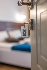 a door with a lock on it in a room at Casa Kollari in Ulcinj