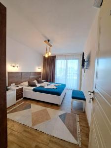 a bedroom with a large bed and a window at Casa Kollari in Ulcinj