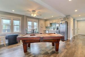 a kitchen with a pool table in a room at 4059 - Bikinis Martinis in Kitty Hawk