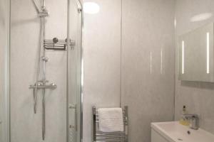 a bathroom with a shower and a sink at 4 Bed in Amble oc-gd1868 in Amble +27 photos