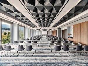 an image of a conference room with tables and chairs at Crowne Plaza Sofia by IHG in Sofia +210 photos