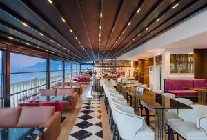 a restaurant with a view of the ocean at Crowne Plaza Antalya by IHG in Antalya