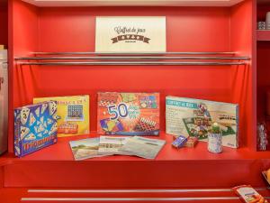 a red shelf with two boxes of candy at hotelF1 Bordeaux Ville in Bordeaux