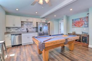 a kitchen with a pool table in a room at 4058 - Beach Haven in Kitty Hawk