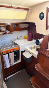 a kitchen with a sink and a stove at Viana Sealife in Viana do Castelo