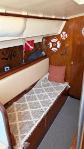 a small bed in the back of a boat at Viana Sealife in Viana do Castelo