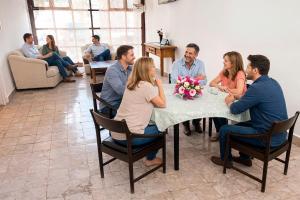 a group of people sitting around a table at HOTEL OASIS Matehuala in Matehuala