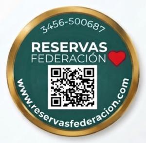 a green and gold button with the wordsresync federation at Complejo - LA ZULA - 1y2Dormitorios in Federación