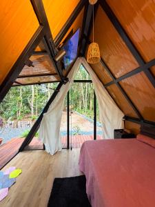 a bedroom in a tent with a bed in it at Bosque dos Buritis in Araguaína +172 photos