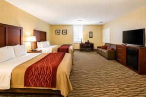 a hotel room with two beds and a flat screen tv at Comfort Inn Pomona near Fairplex in Pomona +41 photos