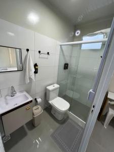 a bathroom with a shower and a toilet and a sink at Urban Box in Sinop