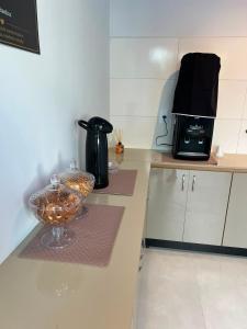 a kitchen with a counter with a glass bowl on it at Urban Box in Sinop