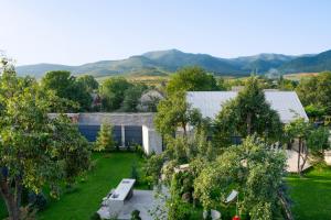 an aerial view of a garden with trees and buildings at Namus House in Stepʼanavan