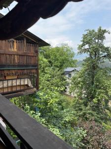 a view from the balcony of a house with trees at Sant House Dilijan in Dilijan