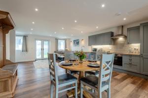 a kitchen and dining room with a table and chairs at 2 Bed in Otterden oc-c36010 in Otterden