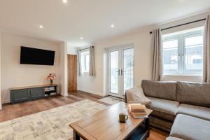 a living room with a couch and a table at 2 Bed in Otterden oc-c36010 in Otterden