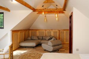 a living room with a couch and a chair at Namus House in Stepʼanavan