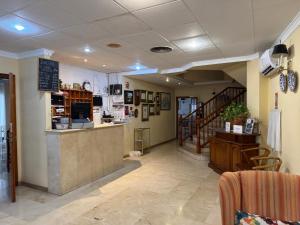 a restaurant with a bar and a counter in a room at Plaça Vella in Sant Carles de la Ràpita
