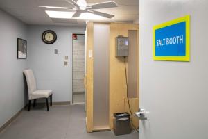 a hallway with a exit door and a ceiling fan at Massanutten Resort by TripForth in McGaheysville +49 photos